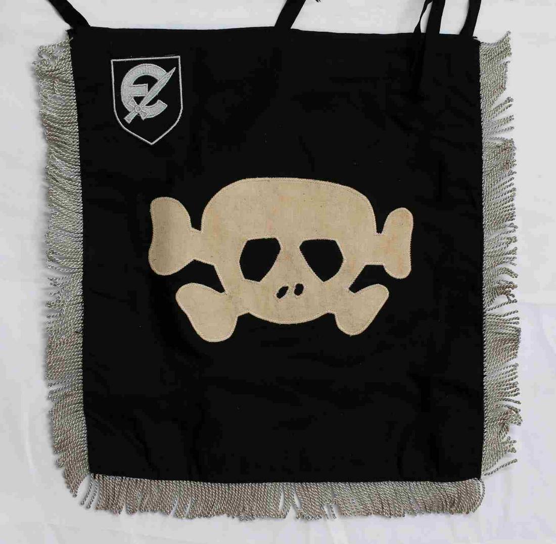 GERMAN WWII WAFFEN 2ND SS PANZER TRUMPET BANNER: Measures 14 1/4" wide by 13 1/4" tall including the fringe. Shows a pair of Waffen SS runics on one side with a Totenkopf skull on the other side. There are machine embroidered Waffen 2nd SS Panzer Di