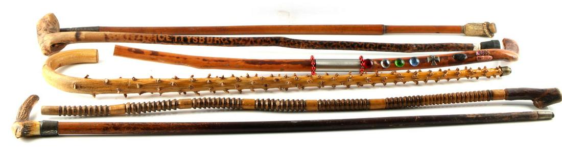 6 ANTIQUE WALKING STICK CANE LOT GOOD VARIETY: Measuring from 29 to 34 inches, one horn grip and sterling wrapped cane, primitives and others as photographed.
