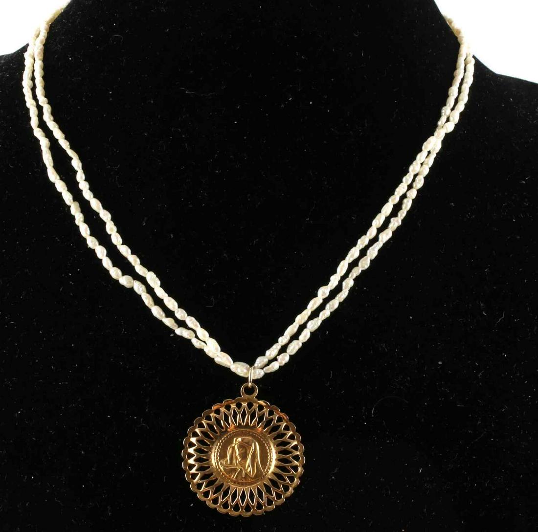 PEARL NECKLACE W 18KT MOTHER MARY CATHOLIC PENDANT: 18KT gold Mother Mary of Jesus pendant has 3 hallmarks (CM, 750, 336W), Clasp marked 14kt. on a dainty freshwater pearl (3-4mm) double strand necklace measuring 18 inches. Pendant weight 3.4 grams