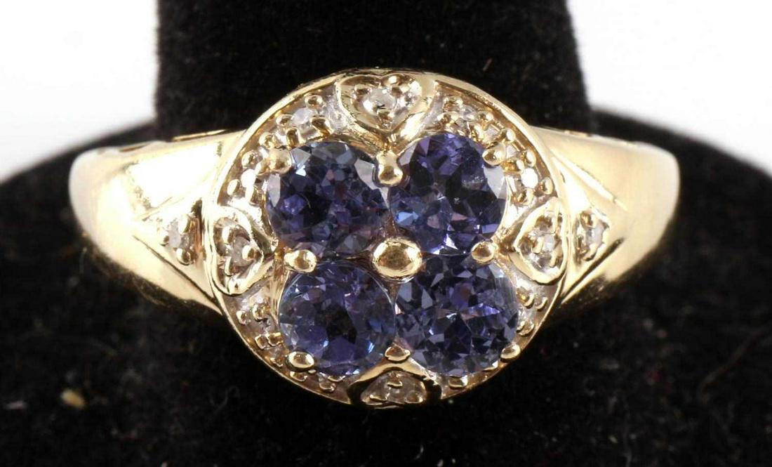 14KT GOLD TANZANITE AND DIAMOND RING SIZE 9: Hallmarked and tested 14kt yellow gold with 1mm diamond accents and featuring four 4mm each Tanzanite gemstones with an est. TCW of 1 carat. Size 9 1/2, total weight 3.5 grams. This lot has a reserve.