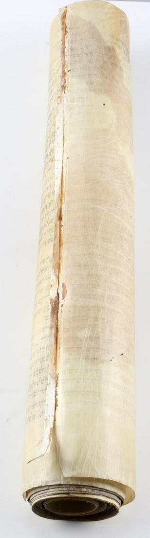 ANTIQUE JEWISH TORAH SCROLL ON PARCHMENT: Torah scroll on parchment, written in Stam script, over 20 feet. Parchment is 18 inches in height. Little wear, overall good condition.