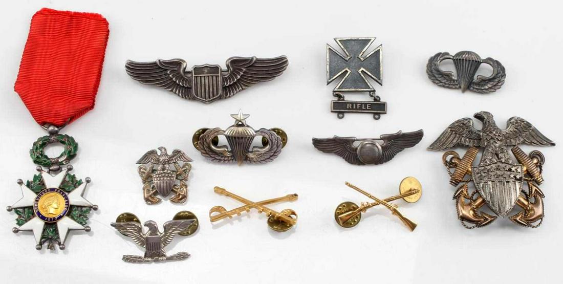 WWII AMERICAN LOT OF 11 WINGS MEDALS STERLING: This lot contains 11 miscellaneous WWII American medals and pins. Item 1 is a WWII US Navy Officer sterling Cap Badge measuring 2.5 inches by 2 inches. Item 2 is a WWII American Paratrooper sterling J