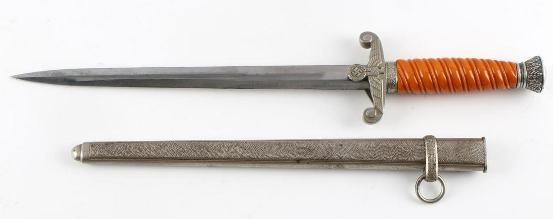 GERMAN WWII THIRD REICH ARMY DAGGER WITH SCABBARD: German World War II Army dagger with pebble scabbard. Blade has very mild patina and little to no scratching. The handle is made of bakelite in very good condition apart from one small crack near the 
