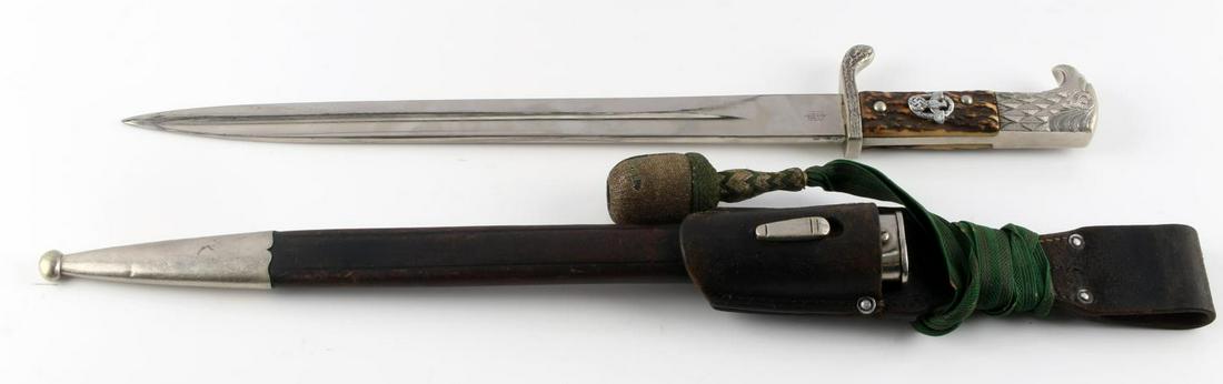 WWII GERMAN THIRD REICH DRESS BAYONET &STAG GRIPS: WWII German third Reich dress bayonet with stag grips, sheath, and a bayonet frog. Knife is in good overall condition and is 17 1/2 inches long in total. The blade is is very good condition and measur