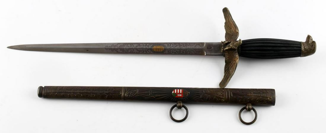 WWII HUNGARIAN LUFTWAFFE PILOTS DAGGER & SCABBARD: WWII Hungarian Luftwaffe Pilot's Dagger and Ornate Scabbard with Hangars. Very good condition with minimal surface wear on the scabbard and blade. Blade is etched and the Hungarian Coat of Arms is sta