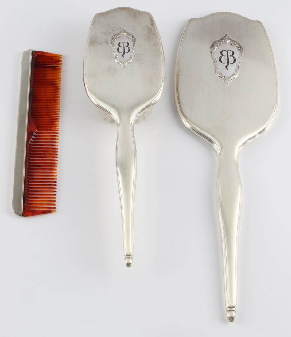 LOT OF 3 STERLING BEAUTY ITEMS EVA BRAUN BUTTERFLY: Lot of three sterling silver beauty items featuring Eva Braun butterfly. Includes mirror, brush, and comb. Comb has tortoise shell type teeth. Brush measures 10.5 inches and is marked "NYLON USA". Mir
