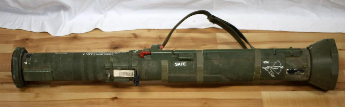 US MILITARY 66 MM GREEN ROCKET LAUNCHER W SLING: 60 Meter and 90 degree range, no caps at either end. Ripped rubber end has an opening that measures approximately 85 mm. Exit opening measures about 67 mm across. Fair condition. May be missing parts.