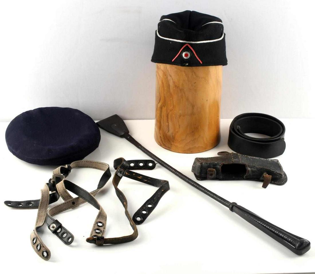 WWII GERMAN GEAR LOT BELT AX COVER SIDE CAP MORE: Includes black military belt 35 inches stamped HJ/DJ 36 no buckle, Fireman Axe leather cover, well crafted leather riding crop, 1940 dated side cap no Reichsadler, Blue Beret, suspenders.