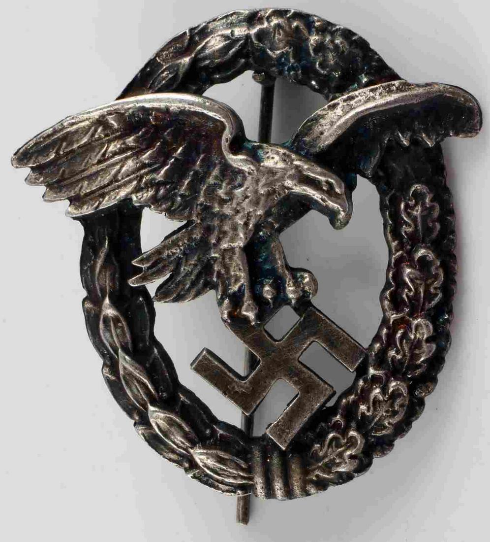 GERMAN WWII THIRD REICH LUFTWAFFE OBSERVER BADGE: Silver finished Third Reich badge, Eagle holding swastika emblem. In decent condition, has light tarnishing on back. Unauthenticated and sold as is. This lot has a reserve.