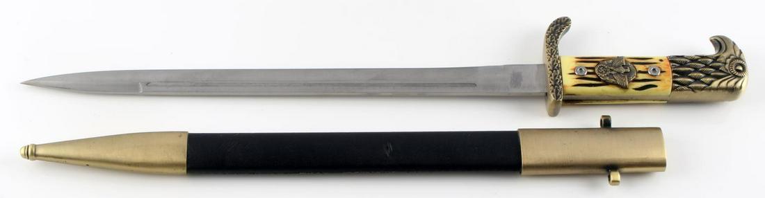 WWII THIRD REICH GERMAN DRESS BAYONET REPRO: Stag grip with gold tone engraved steel fittings, 11.25 inch blade, leather and metal scabbard. Very good condition. Reproduction dagger.