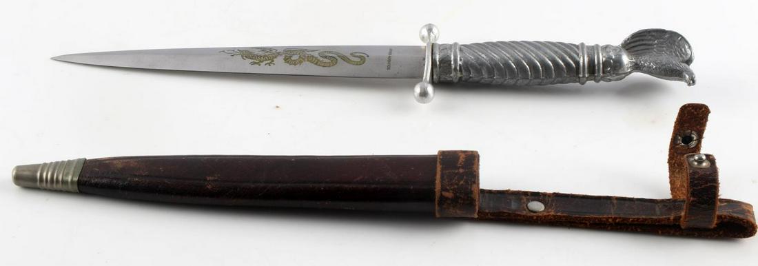 STEEL GERMAN DAGGER WITH EAGLE POMMEL & SHEATH: Post war German steel dagger with eagle pommel and leather sheath. The knife in total is 10 1/8 inches long. The blade itself is 6 inches long, and features a mark that reads "SOLINGEN GERMANY" and an