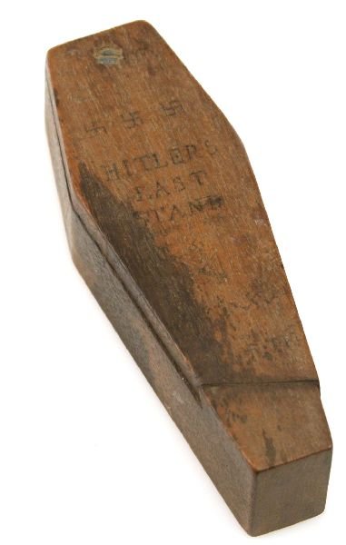 PRISONER OF WAR WOOD WORK HITLERS LAST STAND: A small casket (4.5 x 1.5 x 1 inches) containing an effigy of Hitler in an uncompromising position. Not for the childrens eyes. The lid has "Hitlers Last Stand" and swastikas. The side has "Natures on