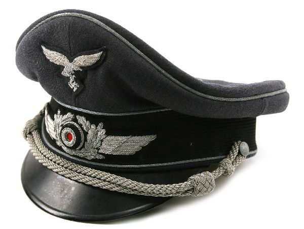 THIRD REICH LUFTWAFFE OFFICERS VISOR CAP: A good officers cap by Errol. Crown with some moth nibbles but generally good. Yellow satin inner with plastic grease guard, leather sweatband shows ink stamps with 1943 date. Size 57.5.