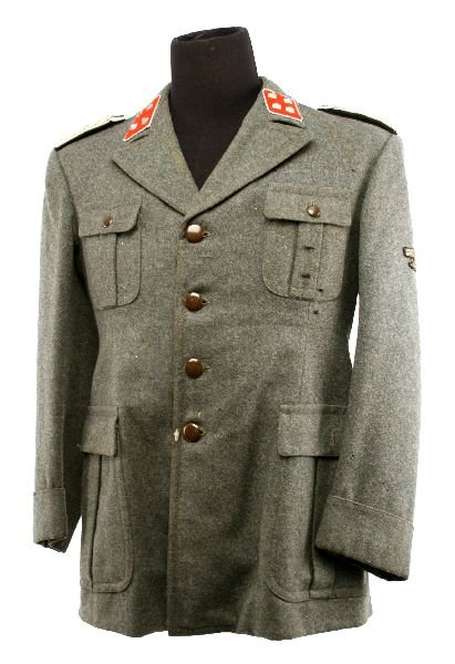 ITALIAN SS OFFICERS FIELD TUNIC: Green/grey wool four pocket tunic with plain brown bakelite buttons. Majors rank on red felt collar badges. Silver wire shoulder boards and Bullion wire eagle, clutching a fasces. Some moth and servic
