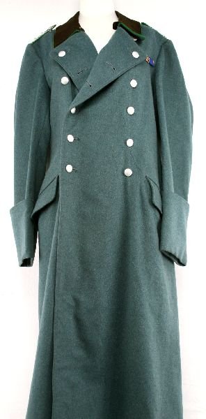 WWII GERMAN PROTECTION POLICE SERVICE GREATCOAT: Green cloth greatcoat with brown collar, C1942. Silver wire shoulder boards with the rank of Captain. Medal ribbon bar to the left breast. very good condition.