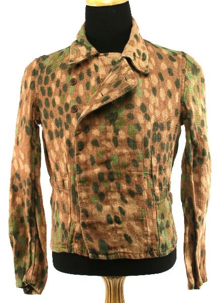 WWII GERMAN SS CAMOUFLAGE WOOL TUNIC: Later, post-July 1944 pattern, wool blend field blouse with Herring Bone Twill weave and machine printed, M44 dot pattern camouflage to the exterior. The camouflage pattern is predominately light brow