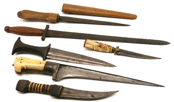 WORLD ANTIQUE DAGGER LOT OF 6: To include; Syrian jamiya with wood and bone inlay grip; Smaller jamiya with ivory handle; an African tribal dagger with wood grip and ribbed blade; A Syrian dagger with much earlier Damascus steel bl