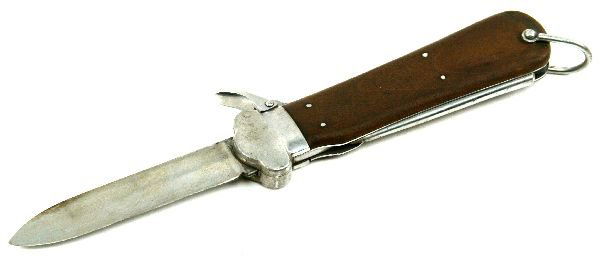 WWII 1ST PATTERN PARATROOPERS GRAVITY KNIFE: 10 inch long knife (fully open). Blade with remnants of a makers mark. Spike with a number 5 at the angle. Hard wood grips with flush rivets.