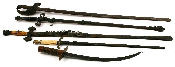 MIXED LOT OF FRATERNAL AND OTHER SWORDS: To include; a Spanish made military type sword; a late 19th century fraternal sword with ivory grip and etched blade; another similar; a cut down fraternal or militia sword and a scimitar sword with m