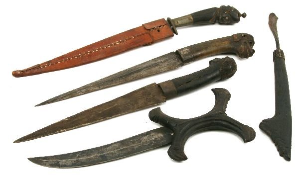 AFRICAN TRIBAL WEAPON LOT OF 5: An interesting lot of good tribal weapons, all with carved wood grips.