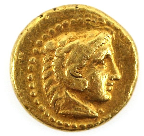 KINGDOM OF MACEDON PHILIP III GOLD EIGHTH STATER: A well centered example 1.94 grams of gold Macedon kingdom Phillip III 359-336 B.C. HD. of young Heracles facing right clad in lions skin, reverse: oivi/iiioy above and beneath thunderbolt.