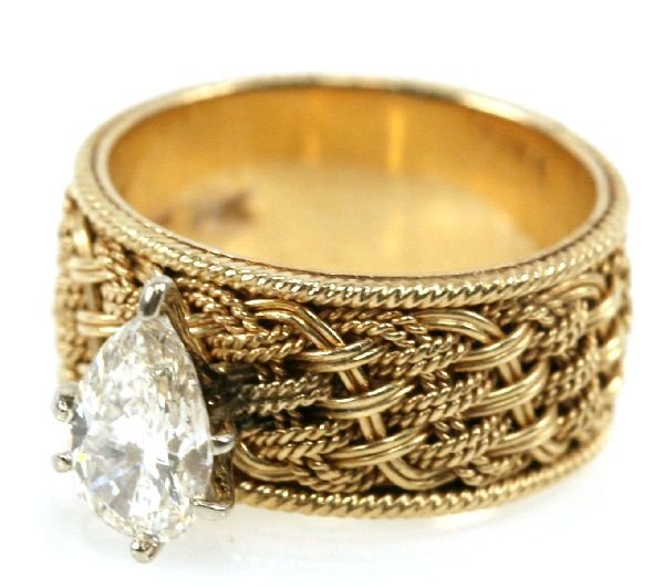 LADIES 1 CARAT DIAMOND PEAR SOLITAIRE 14K RING: Set atop a basket weave design 14K yellow gold ring, a beautiful approx. 1 ct. pear solitaire diamond. 6 prong set. H-I VS1 quality. 7.3 grams. Size 6 1/4.