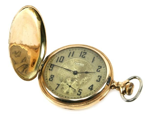 ANTIQUE ELGIN 10K GOLD POCKET WATCH: 15 Jewel 10K Elgin pocket watch. 4.5 cm gold dial with Arabic numerals. Movement # 8004422. Case # 2044841. 106.3 g.