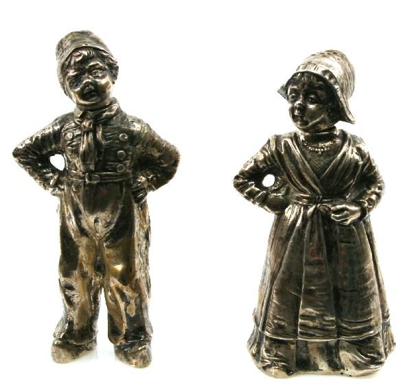 800 SILVER SALT & PEPPER SHAKERS: German marked 800 silver boy and girl salt and pepper shaker. Discoloration on the boy's pants, but otherwise excellent condition.