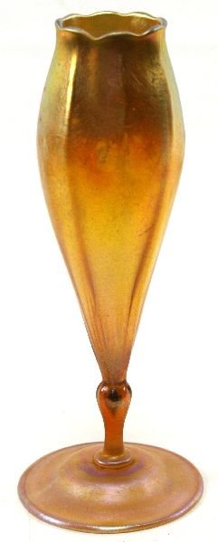 TIFFANY FAVRILE GLASS OR VASE: Fine 1906-1908 Caribbean L.C. Tiffany vase, floriform in ribbed gold favrile glass, exceptional overall iridescence. Signed 4366 L.C. Tiffany Favrile, 11.5 inches. No cracks or chips.