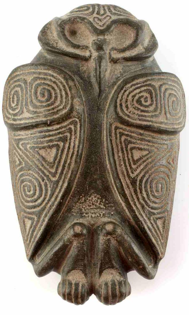 TAINO CULTURE STONE BIRD OWL EFFIGY DOMINICAN: Circa 1000AD - 1500AD. Circular eyes, exceptional carved detail, face carved into forehead. Measures 7 5/8 inches long. Lies flat. Very good condition. From the Roberts Collection, Author of “Taino 
