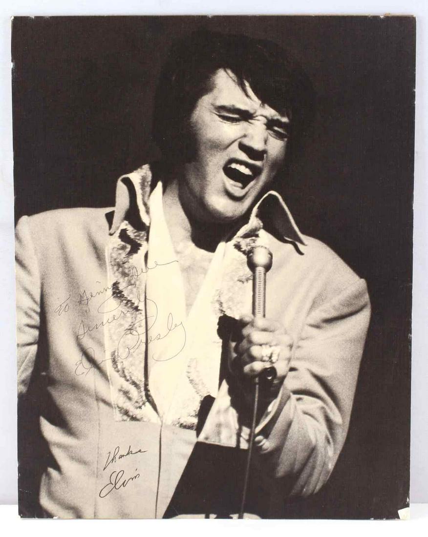 1970S SIGNED ELVIS PRESLEY AUTOGRAPH PICTURE: (14in. L x 11in. W) picture signed by Elvis. Deemed authentic according to terms.
