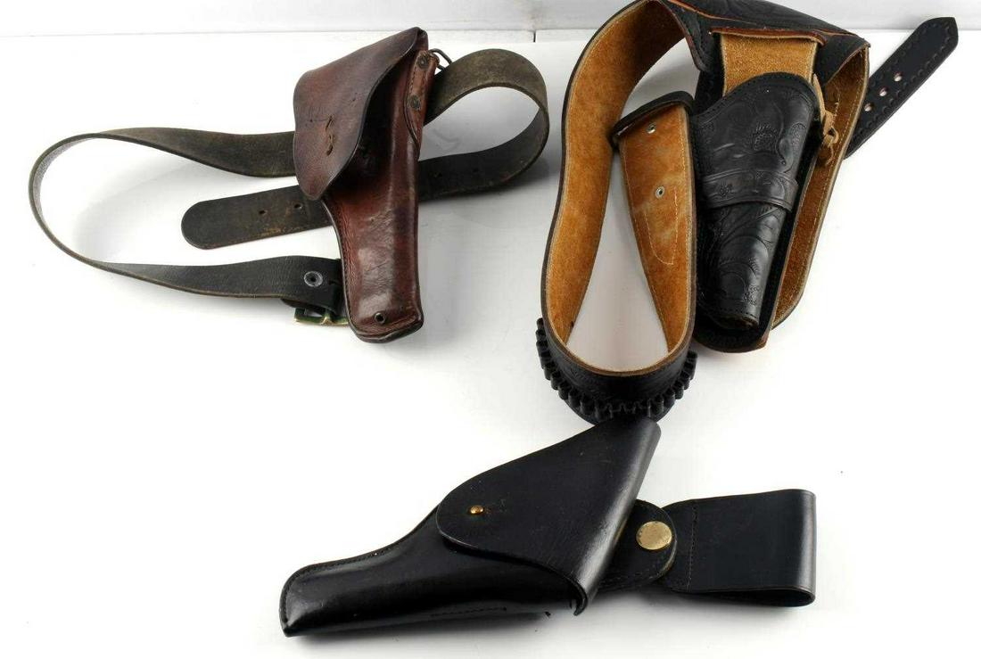 WW1 VINTAGE SINGLE ACTION HOLSTERS WITH BELT: Lot includes 1 WW1 Colt belt measures 45 inches, 1 unknown single action holster and belt measures 45 inches, and 1 Colt 45 Bucheimer police holster