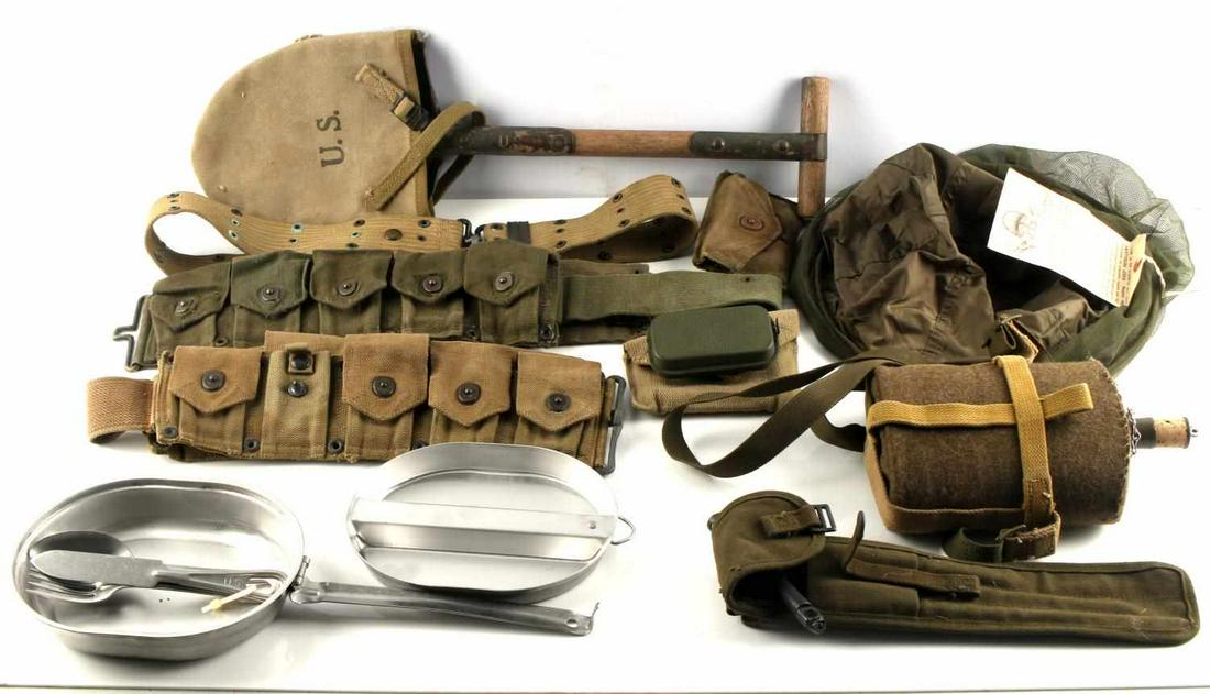 WWII US & BRITISH WEB GEAR AMMO BELT CANTEEN MESS: Lot includes M-1910 entrenching tool with 1943 dated cover, WWII British army wool covered canteen, M1944 mosquito head netting with tag, Wyott WWII canteen with Cutlery, Case 1944 dated M-1 Cleaning 