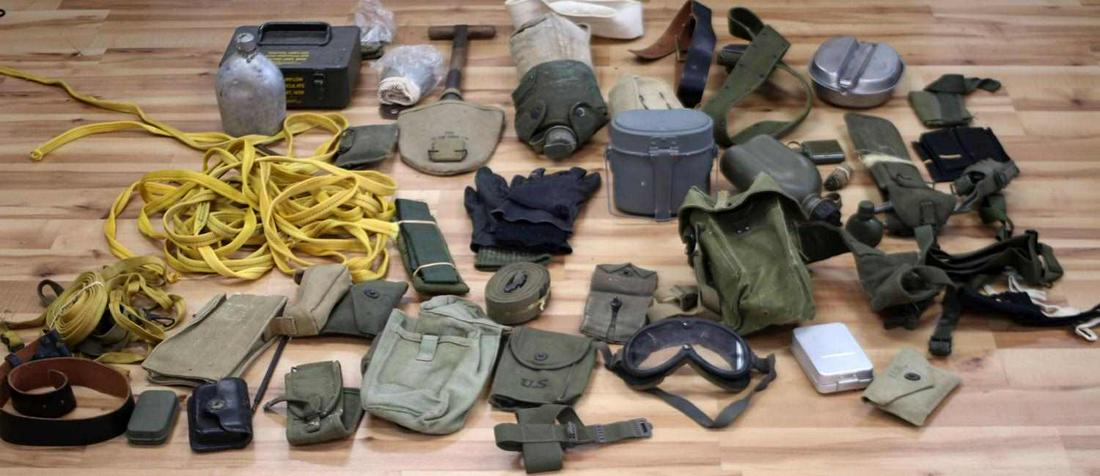 WWI WWII VIETNAM MULTI CONFLICT U.S. & WORLD GEAR: Big selection of web gear, belts ammo pouch, bandage pouch, canteens, mess kit. M-1 rifle cleaning kits, British, Israeli, German gear, goggles. M1910 entrenching tool with 1943 cover, web straps, tie