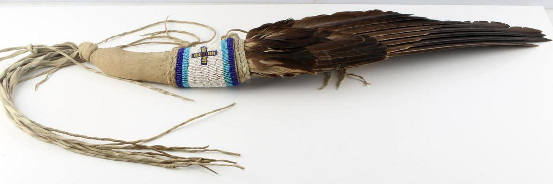 NATIVE AMERICAN CEREMONIAL FEATHER SMUDGE FAN WAND: Medicine man Spiritual Shaman smudge prayer feather fan wand used for wafting sage smoke during cleansing ceremonies. Crow bead word with hide leather handle. In very good condition. Length 30 inches.