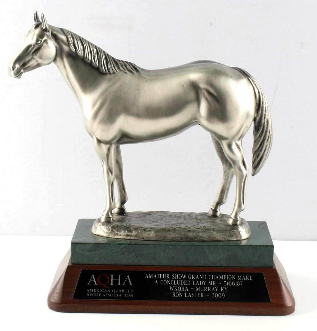 QUARTER HORSE AMATEUR MARE CHAMPION TROPHY 2009: Grand Champion trophy for the American Quarter Horse Association in the Mare competition. 2009. With plaque. Horse sculpture is signed by Mehl Lawson. 11 x 6 inches at the base, and 12.5 inches tall.