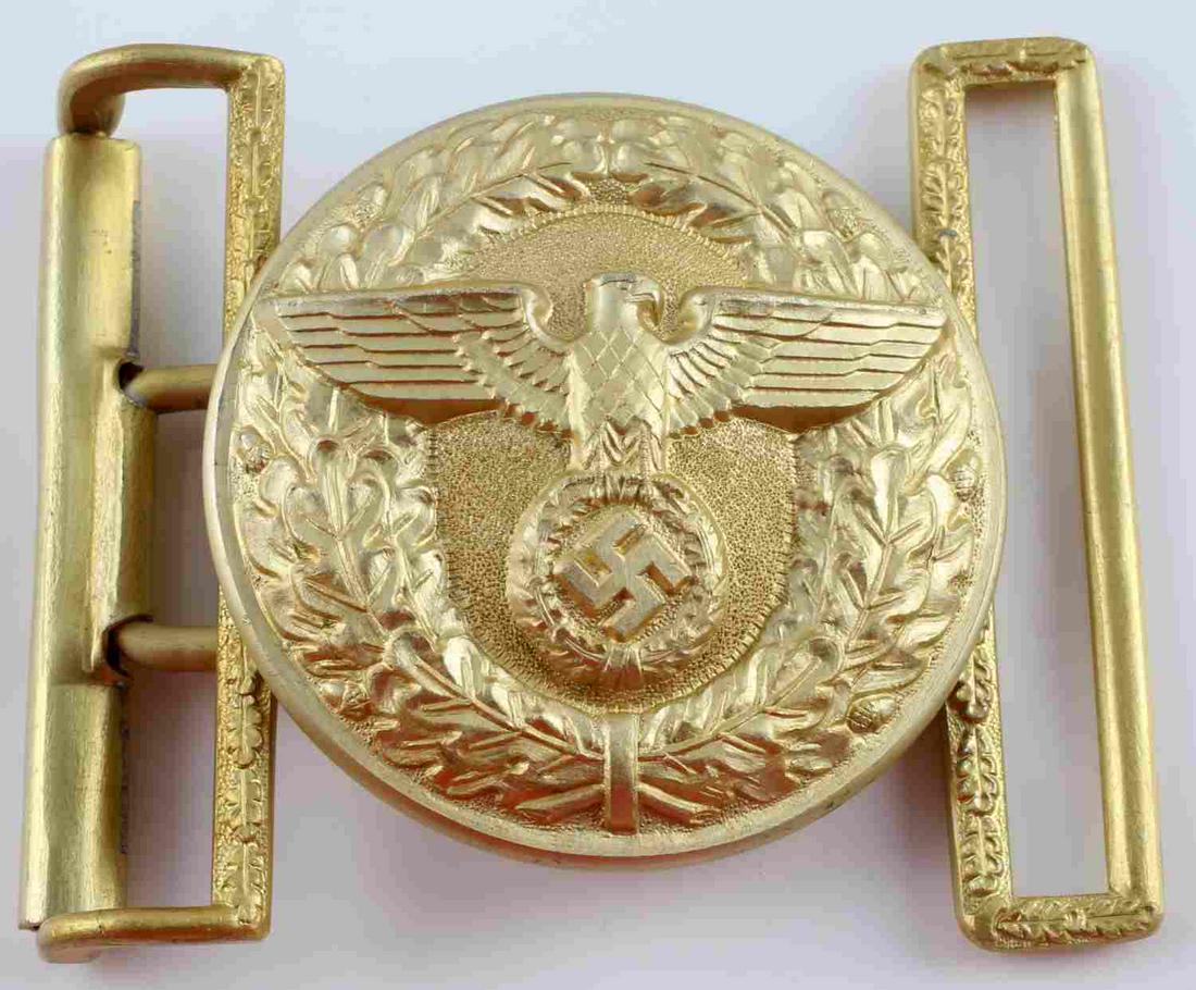 NSDAP THIRD REICH PARADE LEADER BELT BUCKLE: NSDAP Third Reich gold finish belt buckle like worn by political leaders. Marked "RZM" logo on back with M4/24 on back as well. 3 inches across. Has both keepers. Unauthenticated and sold as is. This