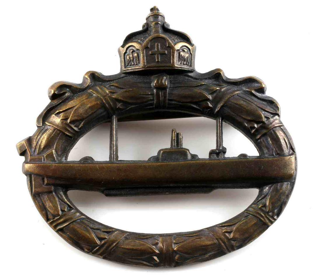WWI IMPERIAL GERMAN BRONZE U BOAT BADGE: WWI Imperial German Bronze U-Boat Badge. Maker's marked Walter Schott Fec on reverse. Badge type made from melted cannon brass. Measures approximately 2 inches wide with a 180 degree pin lie. Overall,