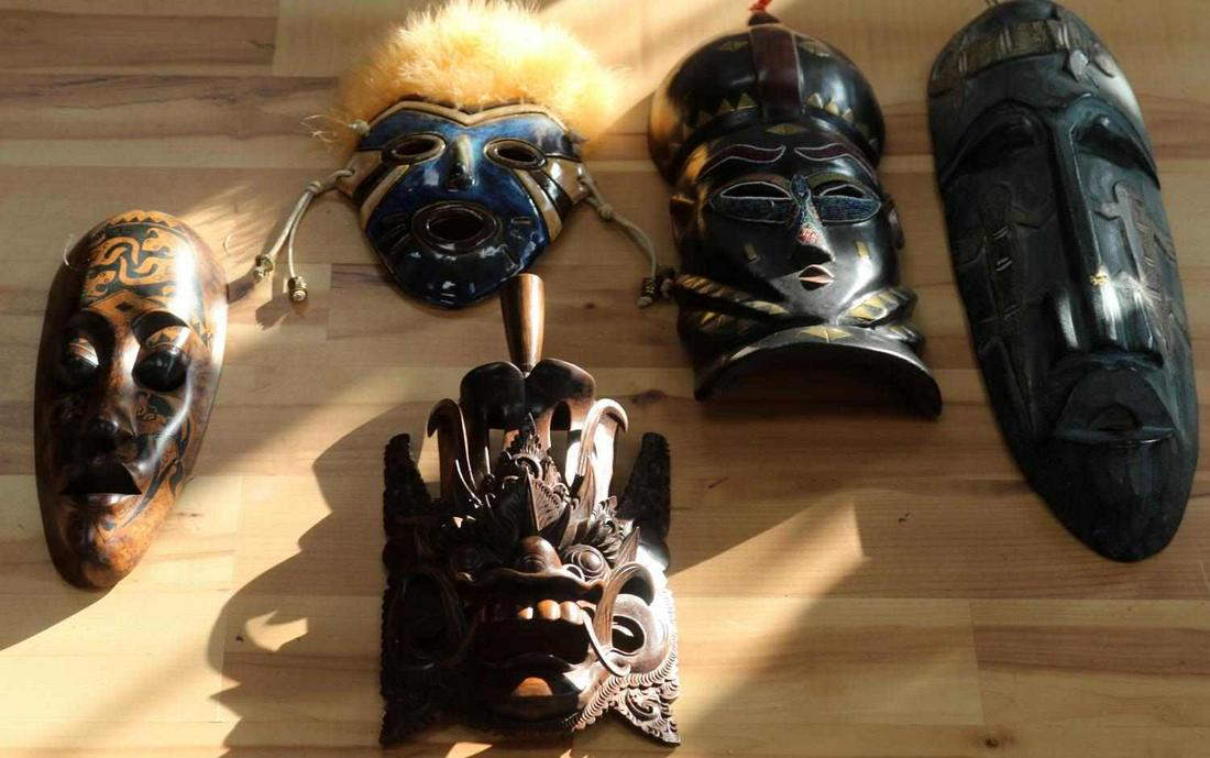LOT OF AFRICAN AND SOUTH PACIFIC OCEANIC MASKS: Lot includes a 14 10/16 x 6 1/2 inches Aburi mask from Ghana, a 20 x 6 inches African mask, a 12 11/16 x 4 3/4 inches African mask, a 13 1/4 by 7 inches Balinese Hanuman monkey mask, a 11 x 7 1/2 mask