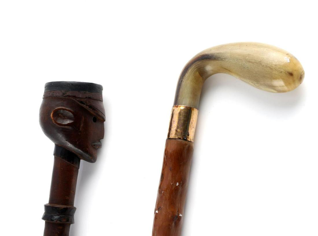 ANTIQUE SUNDAY STICK & OFFICER HEAD WALKING CANE: Lot of 2. 1) The golf Sunday stick has tested for 9k gold wrap. Unmarked, except "Briggs London", horn handle , white metal ferrule tip, knobby blonde wood. Very good condition. Measures 33 inches. 2)