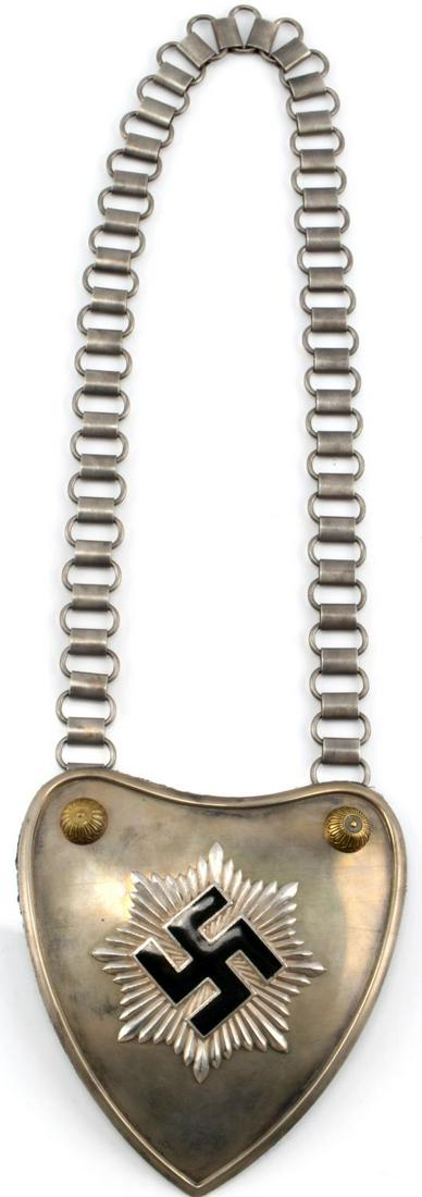 WWII GERMAN 3RD REICH RLB GORGET COMPLETE W CHAIN: German RLB gorget, complete with chain. H. Aurich Maker. Thin dye struck sunburst with enamel swastika. Very good condition. This lot has a reserve.