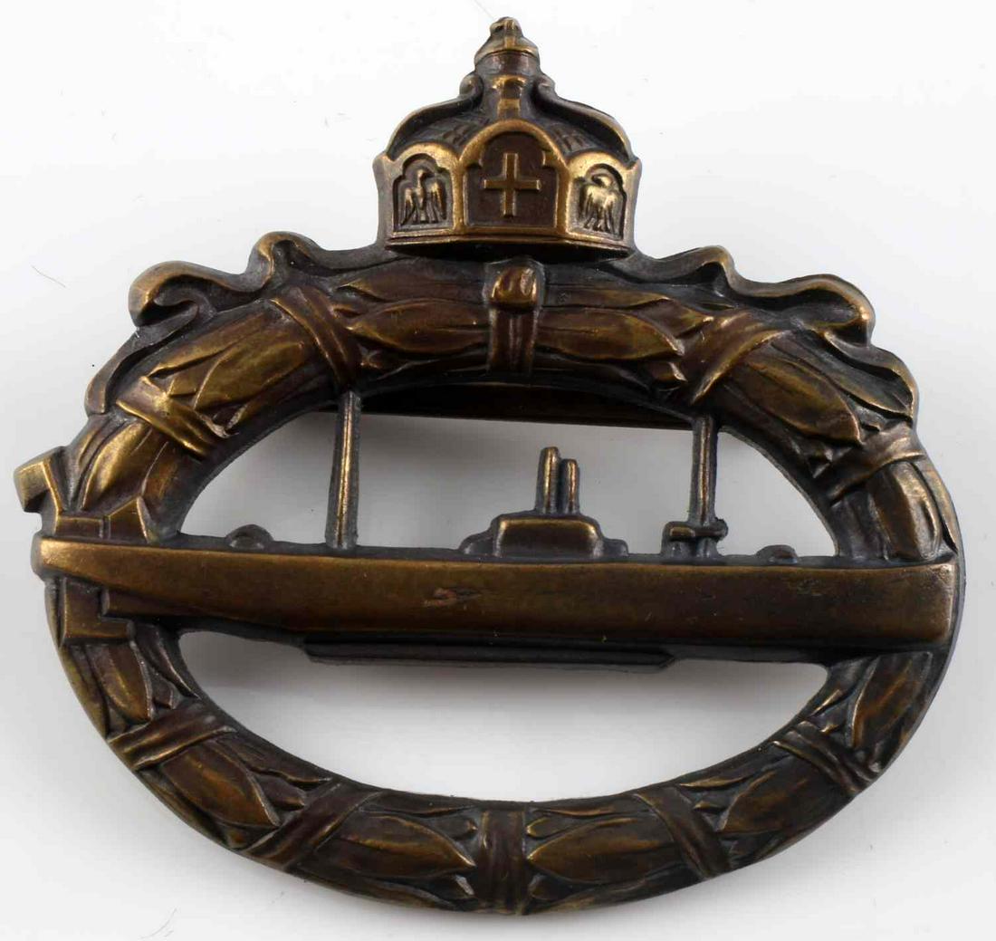 WWI IMPERIAL GERMAN U-BOAT BADGE IN BRONZE: WWI German U-boat badge. Massive type made from cannon brass. Reverse marked "Walter Schott fec." Measures 55mm x 50mm. This lot has a reserve.