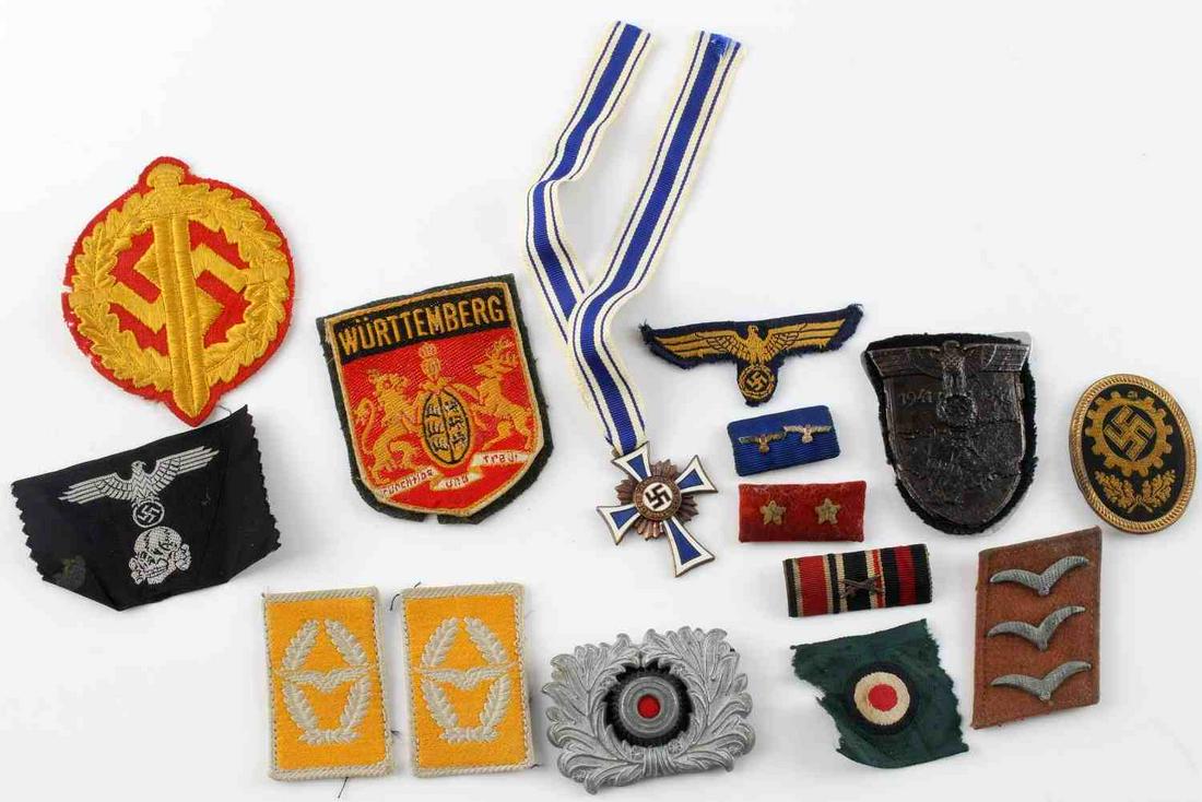 14 WWII THIRD REICH GERMAN PATCHES AND CROSS LOT: Lot contains 14 patches and 1 Cross of Honor of the German Mother. Some of the patches are a WW2 German Luftwaffe Airman First Class Obergefreiter Collar Rank Insignia, a Wurttemberg, and totenkoph pa