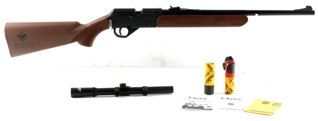 DAISY 1910 BOY SCOUTS PELLET AIR RIFLE .177 CAL: Youth pellet rifle with Boy Scouts of America marked to rear stock. Comes with 4X15 scope, detached, in original box. Very good condition.