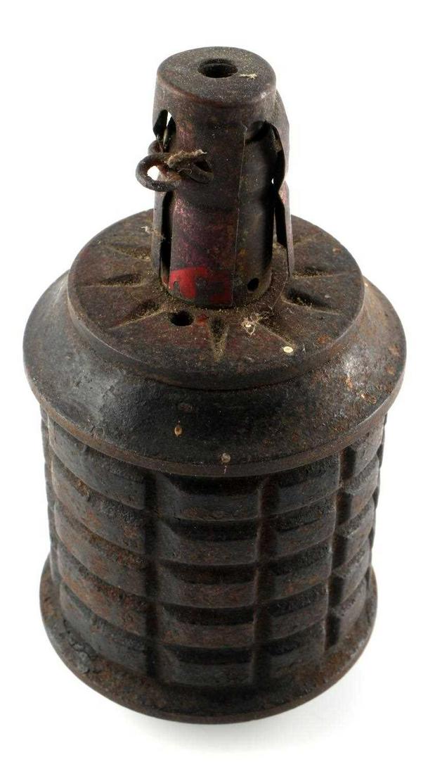 WWII IMPERIAL JAPANESE TYPE 97 INERT HAND GRENADE: WWII Japanese Type 97 inert hand grenade issued to the Imperial Japanese Army. Grenade shows rust and age. Does unscrew and open. Measures 105mm.