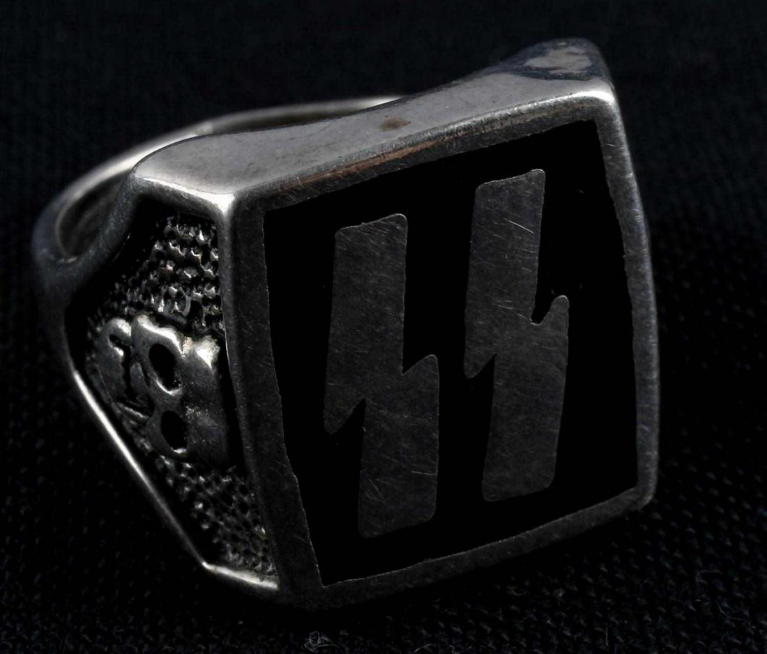WWII GERMAN THIRD REICH SS RING SIZE 9 SKULL: WWII German SS Ring. Size 9. "G&S 10 850" engraved on the underside of the SS face. Skull on each side. Ring sows some wear. Unauthenticated, sold as is.
