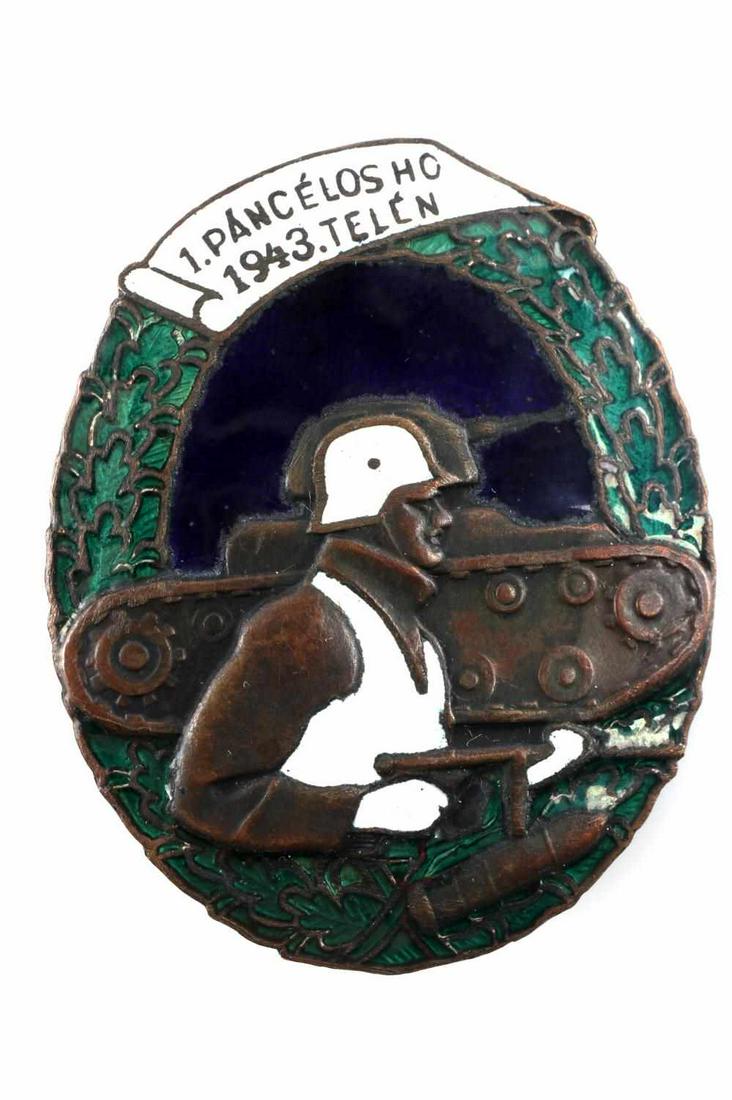 WWII HUNGARIAN 1ST ARMORED TANK ASSAULT BADGE 1943: WWII Hungarian 1st Armored Tank Division Badge. Multi -colored enamel with helmeted soldier walking with tank. Equivalent to German Panzer assault badge. Very good condition. Unauthenticated, sold "as