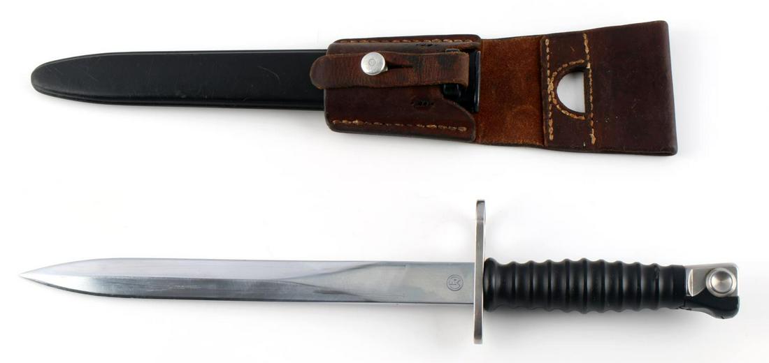 STG 57 SWISS MILITARY BAYONET WITH LEATHER FROG: Blade measures 9 3/8 inches. Hilt and blade together measures 14 9/16 inches. Very good overall condition.