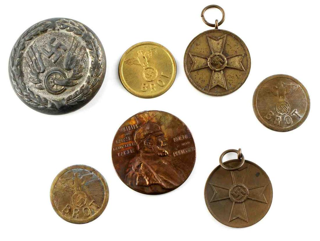 WWII THIRD REICH 3 BROTHEL TOKENS MEDALS AND: Lot contains three 1 inch diameter BROT tokens, two 1 1/4 inch diameter Fur Kriegsverdienst 1939 Medals, a 1 1/2 inch diameter German Railway Service clip, and a 1 1/2 inch diameter Wilhem Der Grosse