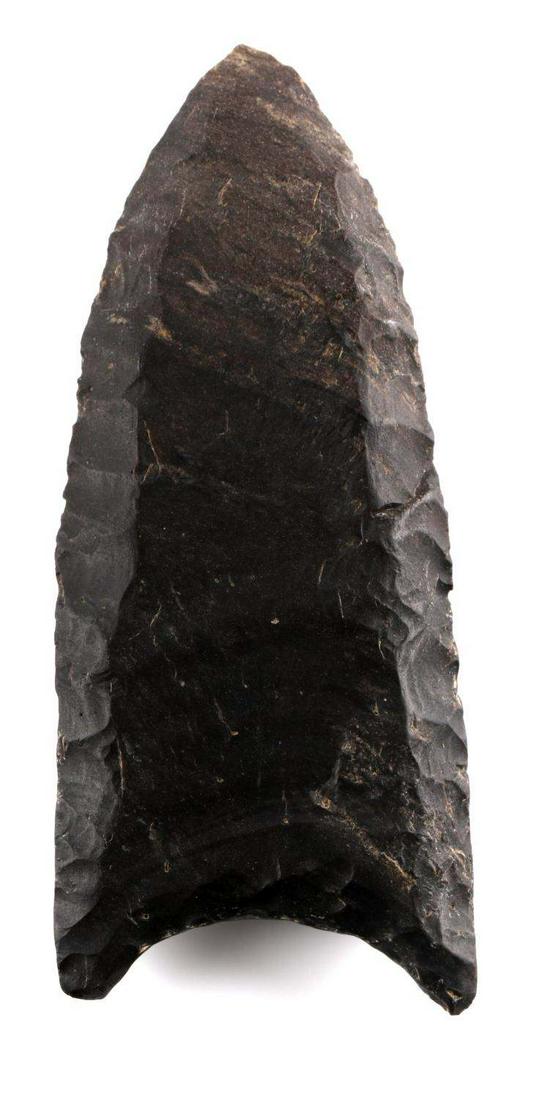 RED STONE DOVER FLINT CLOVIS ARROWHEAD DECATUR TN: Charcoal colored, flute on each side that runs entire length, parallel flaking, 2 3/8 inches long. From Decatur county, TN.